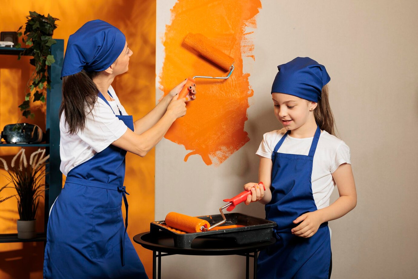 small-family-painting-orange-walls